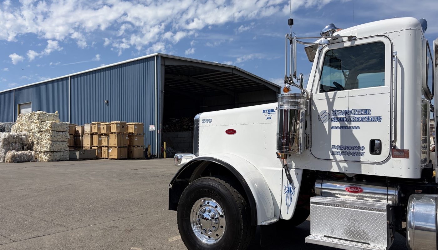 A Skagit River Steel & Recycling truck parked in front of the Burlington facility