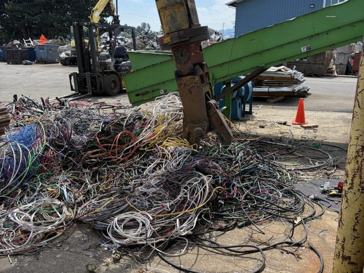 Material handler sorting non-ferrous scrap metal